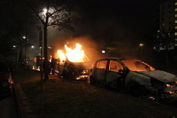 Second_day_of_Husby_riots,_three_burning_cars.jpg